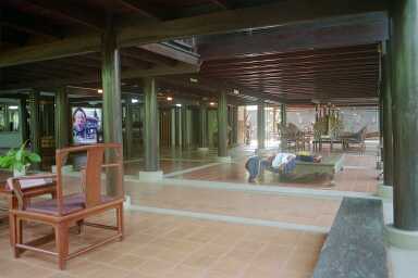 The open ground floor seen from the paved pathway